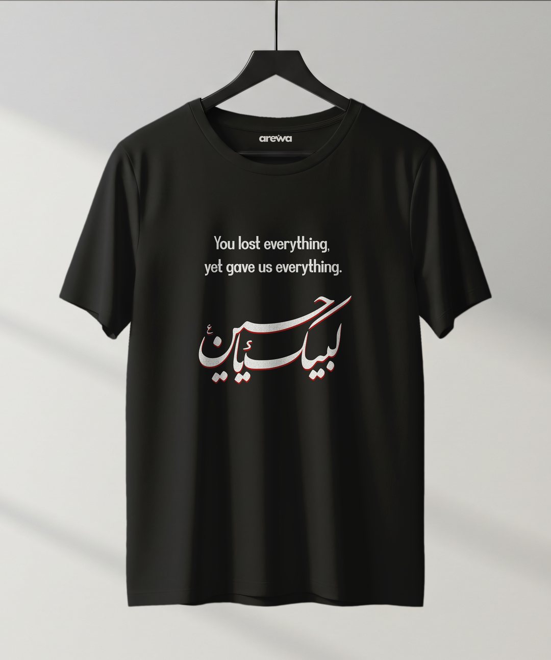Black t-shirt with “You Lost Everything Yet Gave Us Everything” quote and Urdu “Labbaik Ya Hussain” calligraphy — Arewa Lifestyle